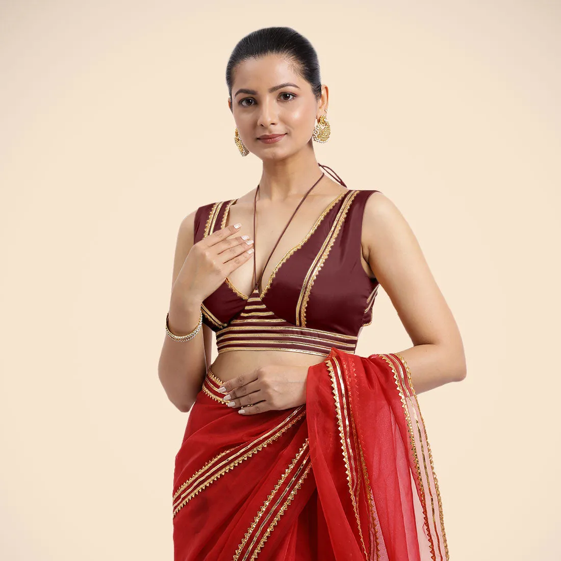 Ahana x Tyohaar | Burgundy Sleeveless FlexiFit™ Saree Blouse with Plunging Neckline and Back Cut Out with Tasteful Golden Gota Lace Embellishment