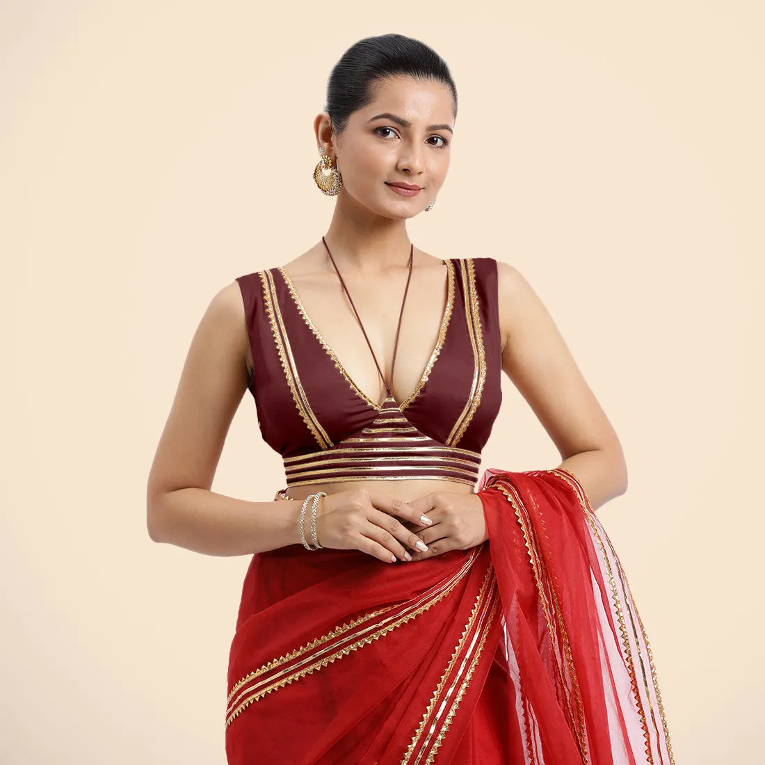 Ahana x Tyohaar | Burgundy Sleeveless FlexiFit™ Saree Blouse with Plunging Neckline and Back Cut Out with Tasteful Golden Gota Lace Embellishment